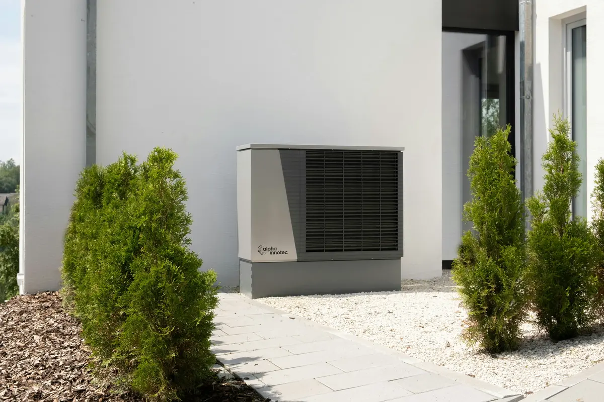 Cold-climate heat pump outdoor unit mounted on Atlanta home exterior