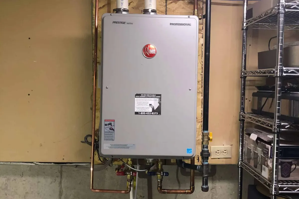 Rheem tankless water heater installed on a wall in a Atlanta basement