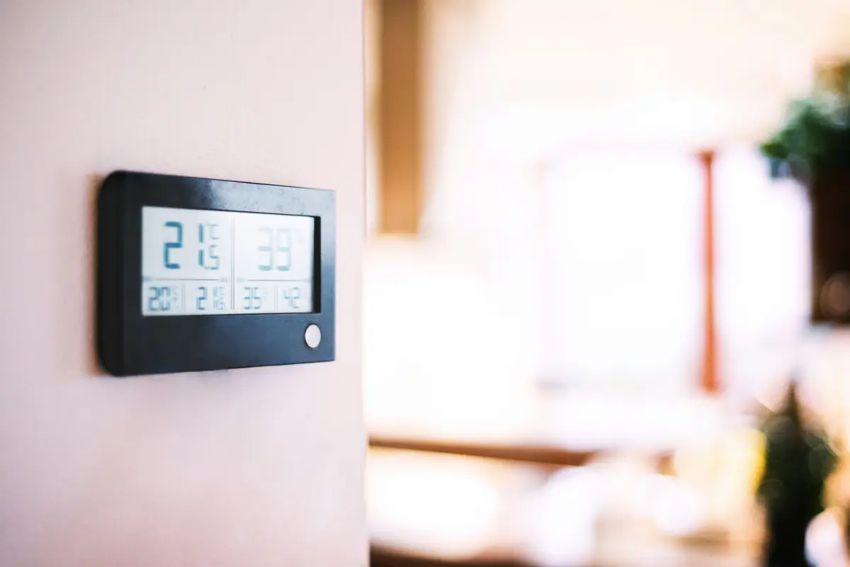 Modern smart thermostat on a residential wall in Atlanta
